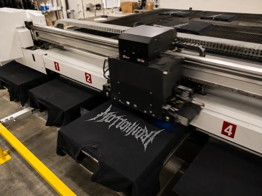 IRONHOLLOW tees printing across the four-station DTG press